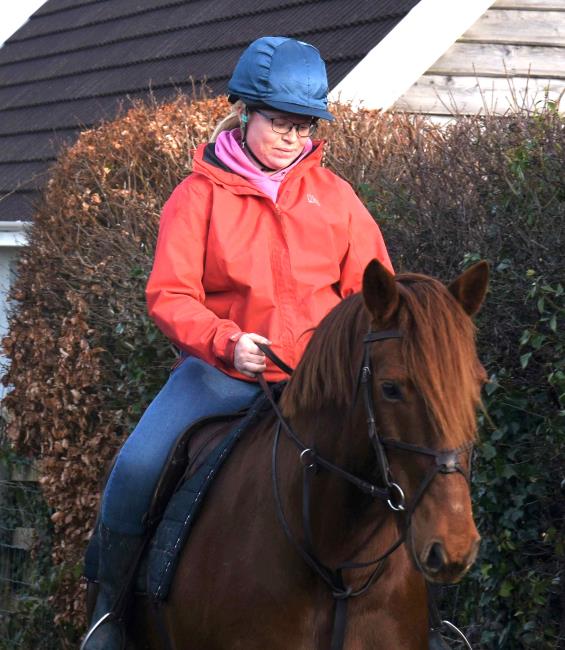 Emily enjoying a quiet moment with her pony